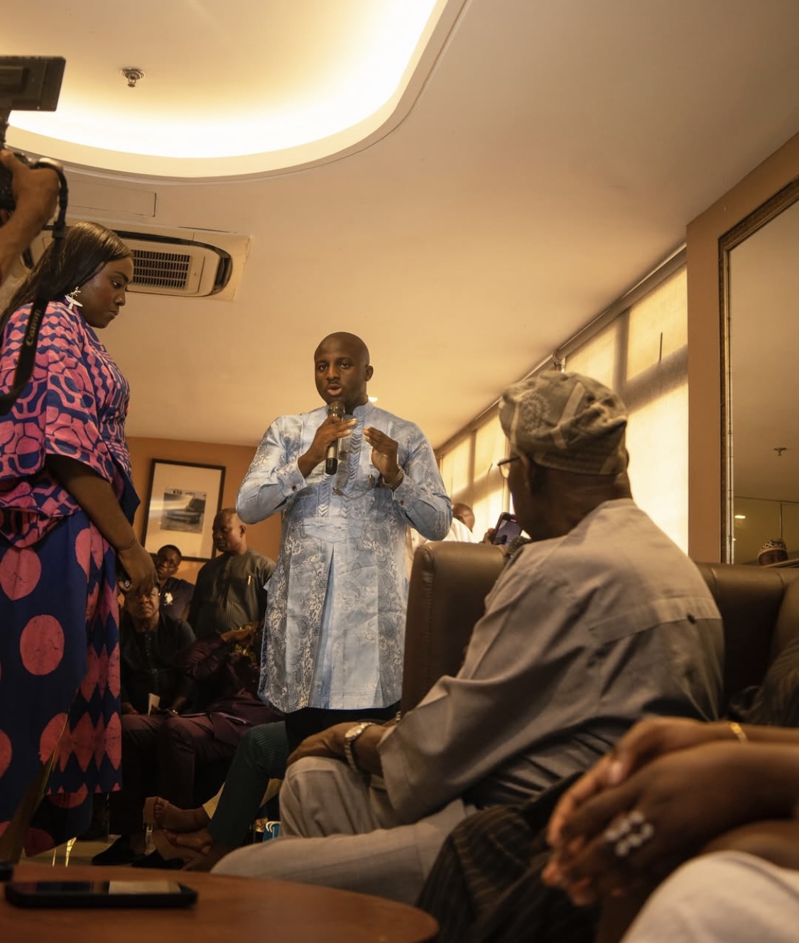 Precious Micah speaking to former Nigerian President Olusegun Obasanjo